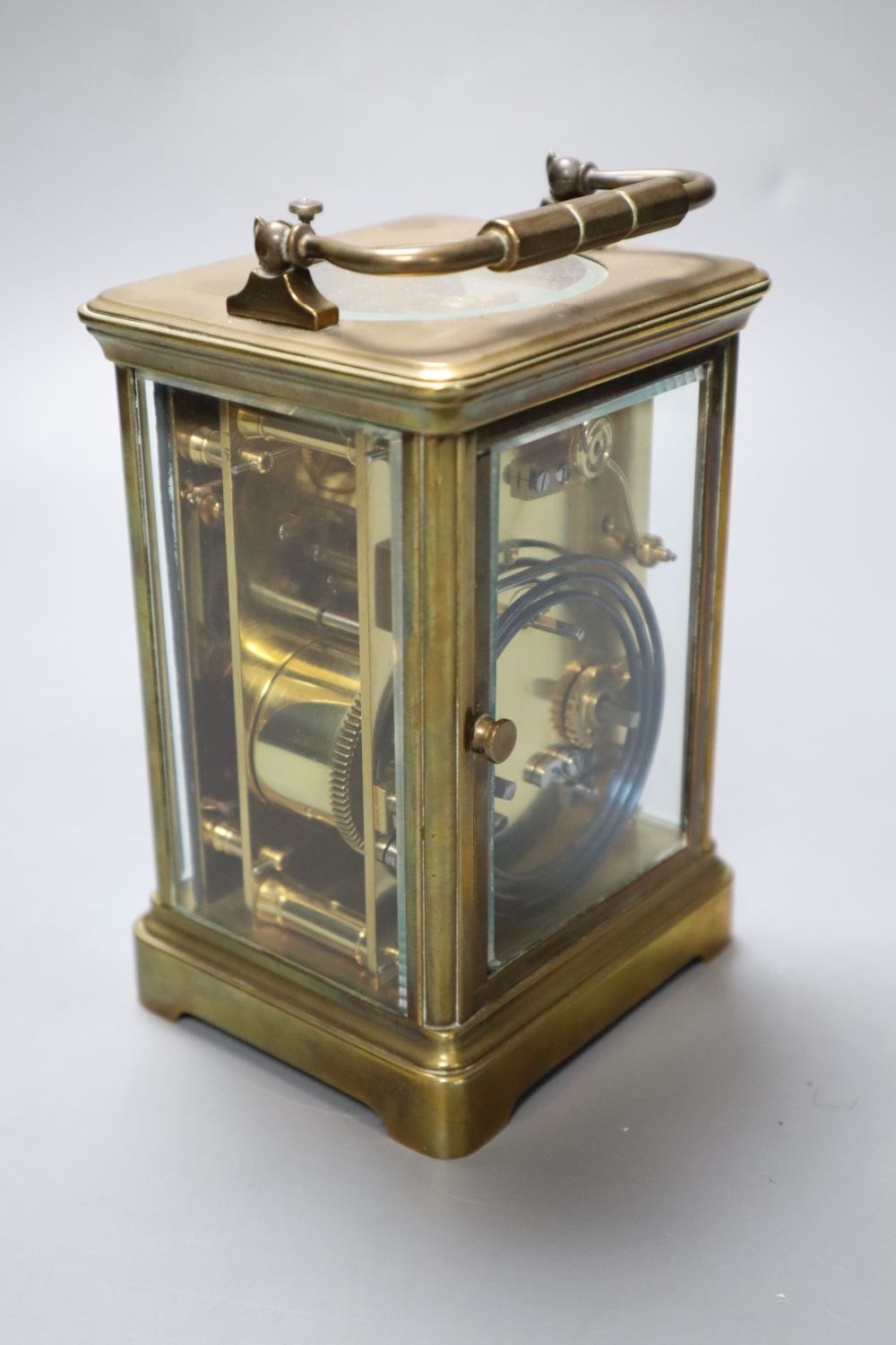 A French brass repeating carriage clock, enamelled dial, Obis case, height 18cm incl. handle